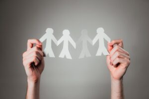How responsibility attributions to self and others relate to outcome ownership in a social context